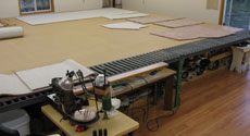 Work table for carpet binding and serging